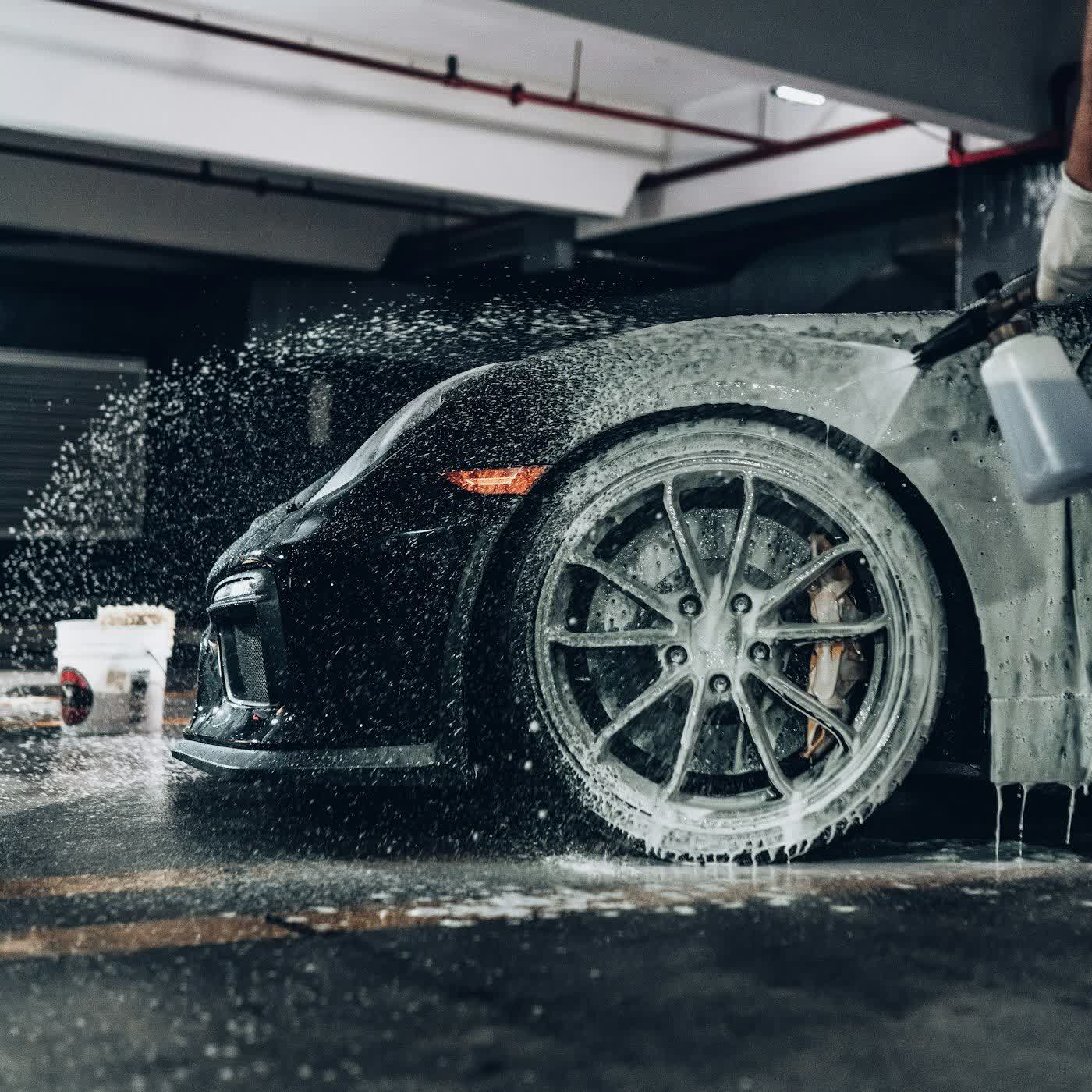Snow foam covering a car before the contact wash