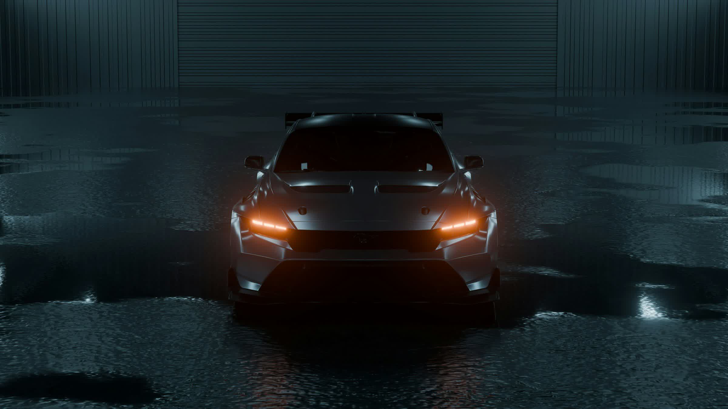 A dark car under inspection lighting in a detailing bay