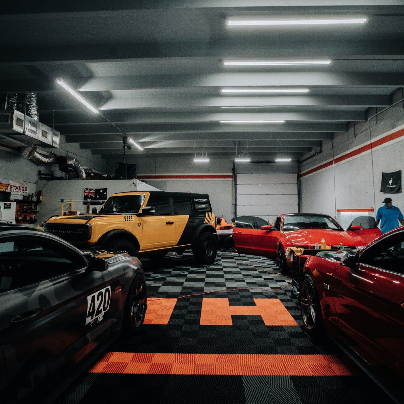 A car on the studio floor under the bay lighting