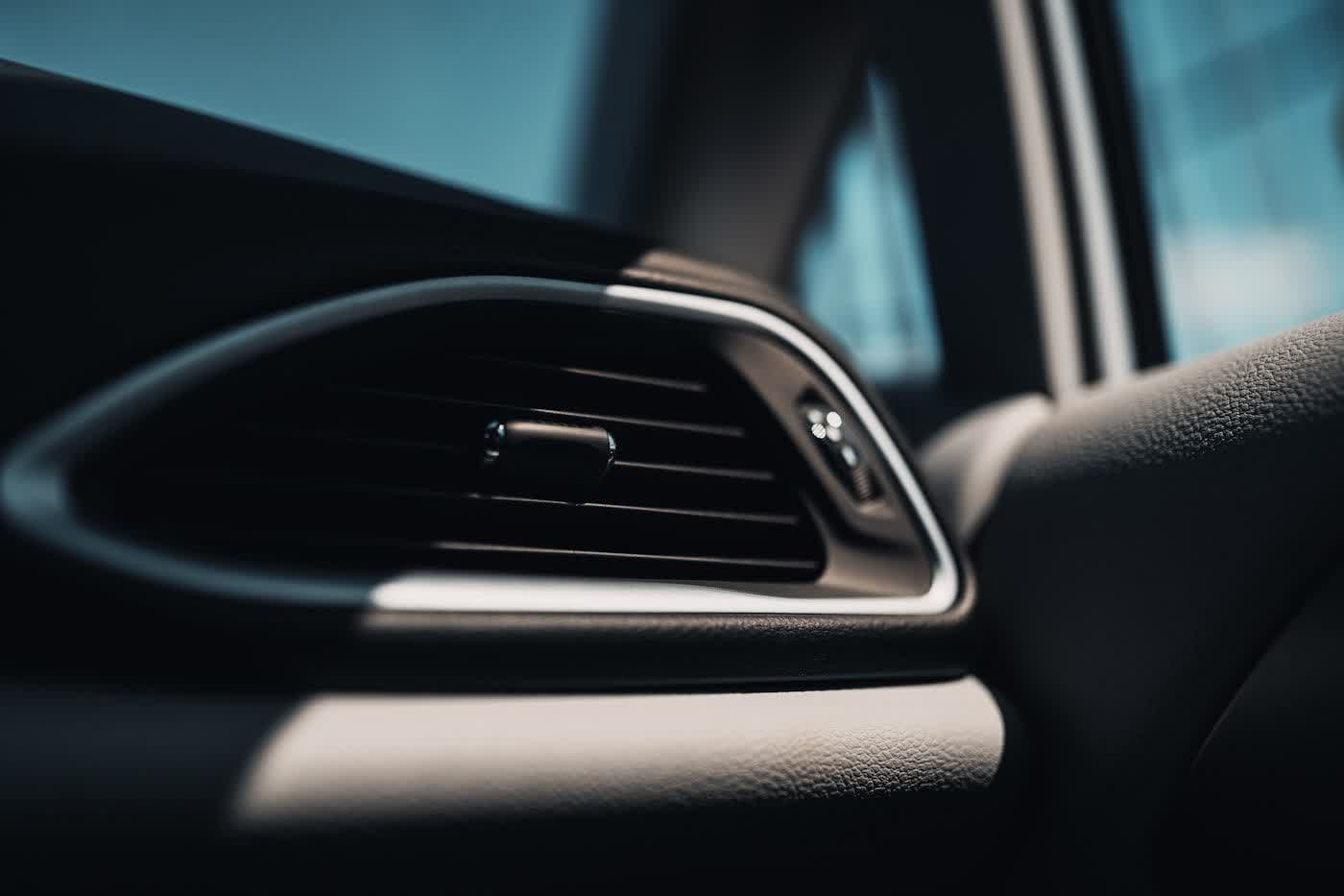 A cleaned dashboard vent and the trim around it